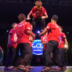 Japanese dance crew performs a trick.